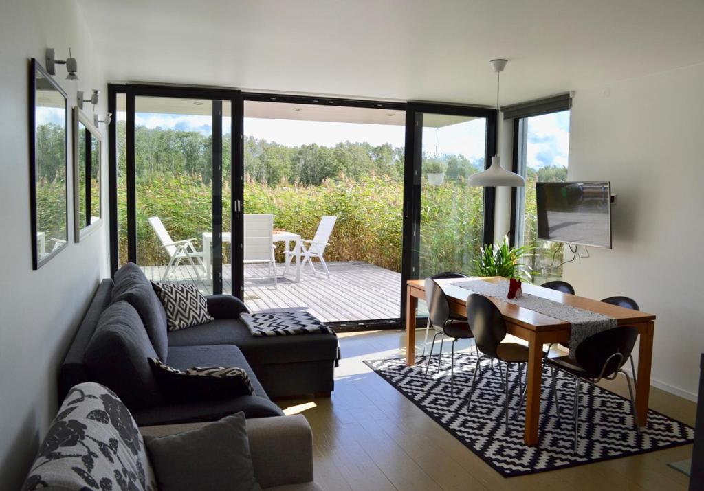 a living room with a couch and a table at Härmati Holiday House in Nasva