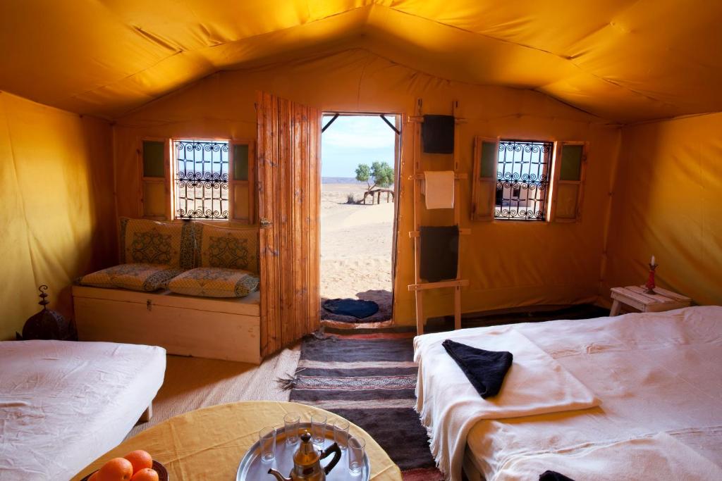 Rúm í herbergi á Bivouac La Dune Blanche