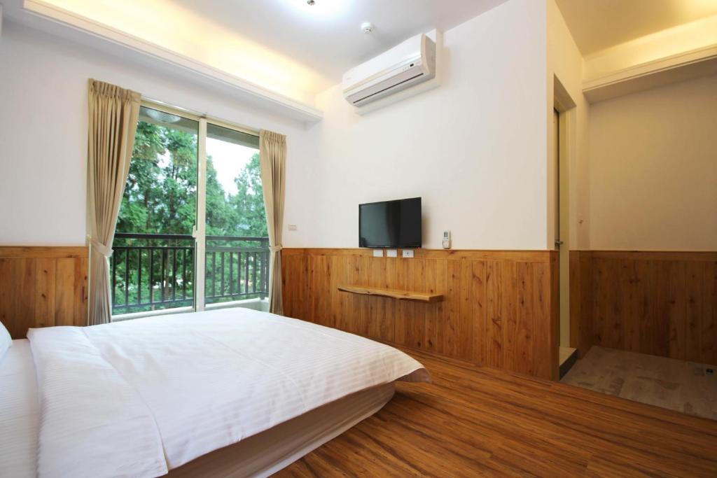 מיטה או מיטות בחדר ב-Ban Tian Tao Fang