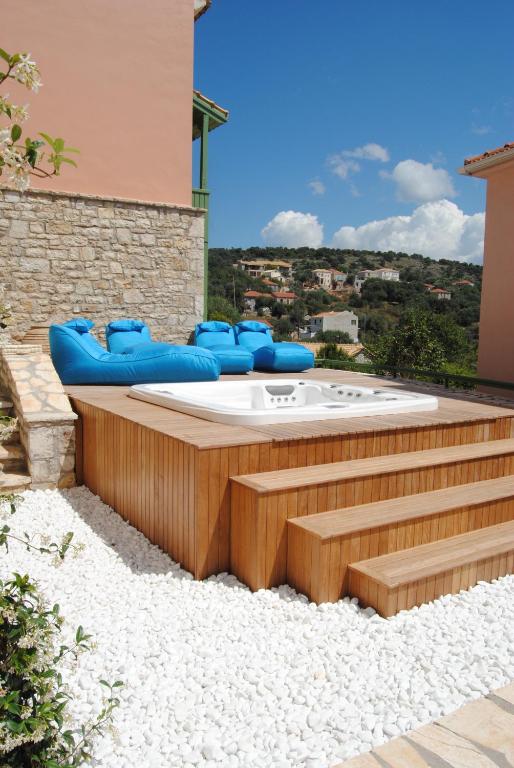 a hot tub sitting on top of a building at Villa Tati in Kastós