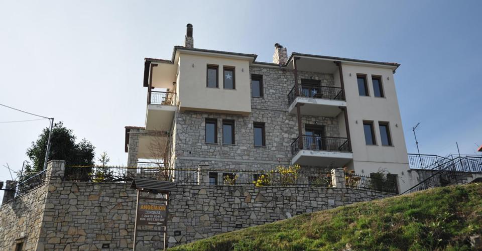 a building on top of a stone wall at Anthemion in Neochori