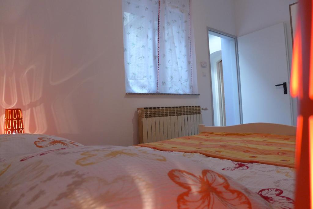 Posteľ alebo postele v izbe v ubytovaní Apartment San Marco