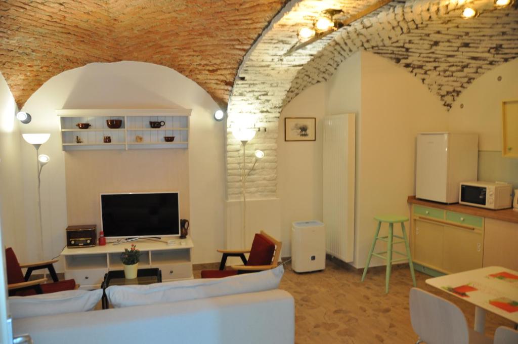 Televízia a/alebo spoločenská miestnosť v ubytovaní Apartment San Marco