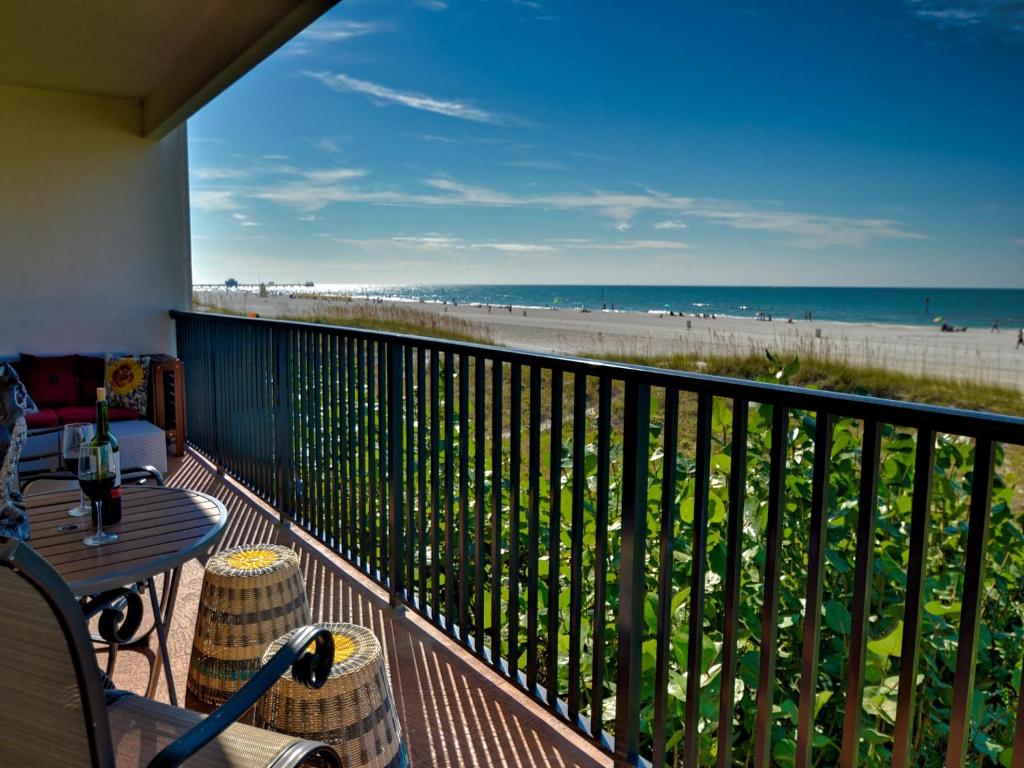 a balcony with a table and a view of the beach at Surfside Condos 202 in Clearwater Beach