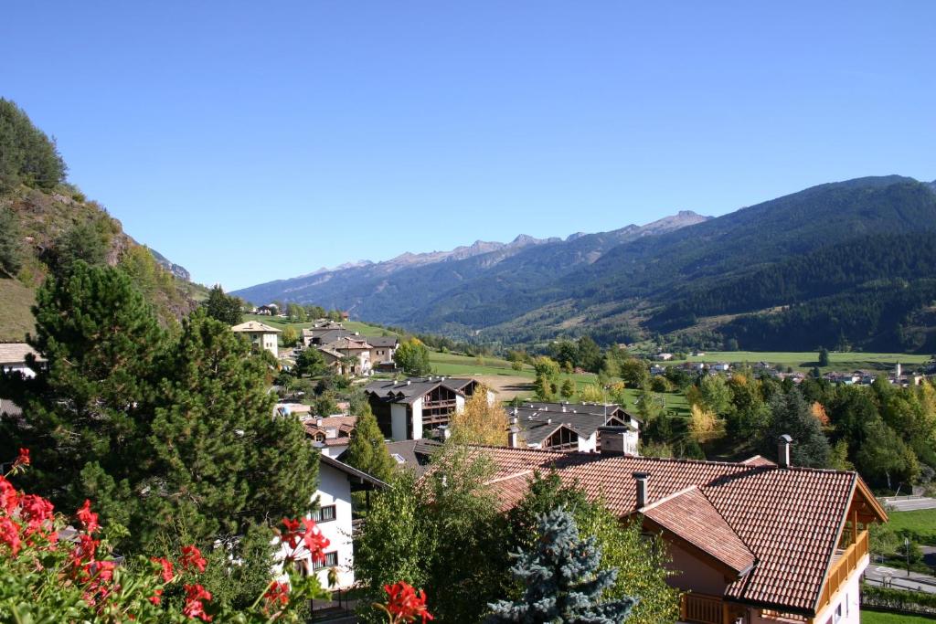 a village in the mountains with houses at Villa Mirabell in Cavalese