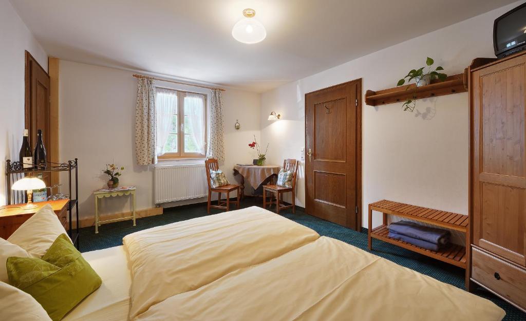 Postel nebo postele na pokoji v ubytování Zum Kirchenbauer