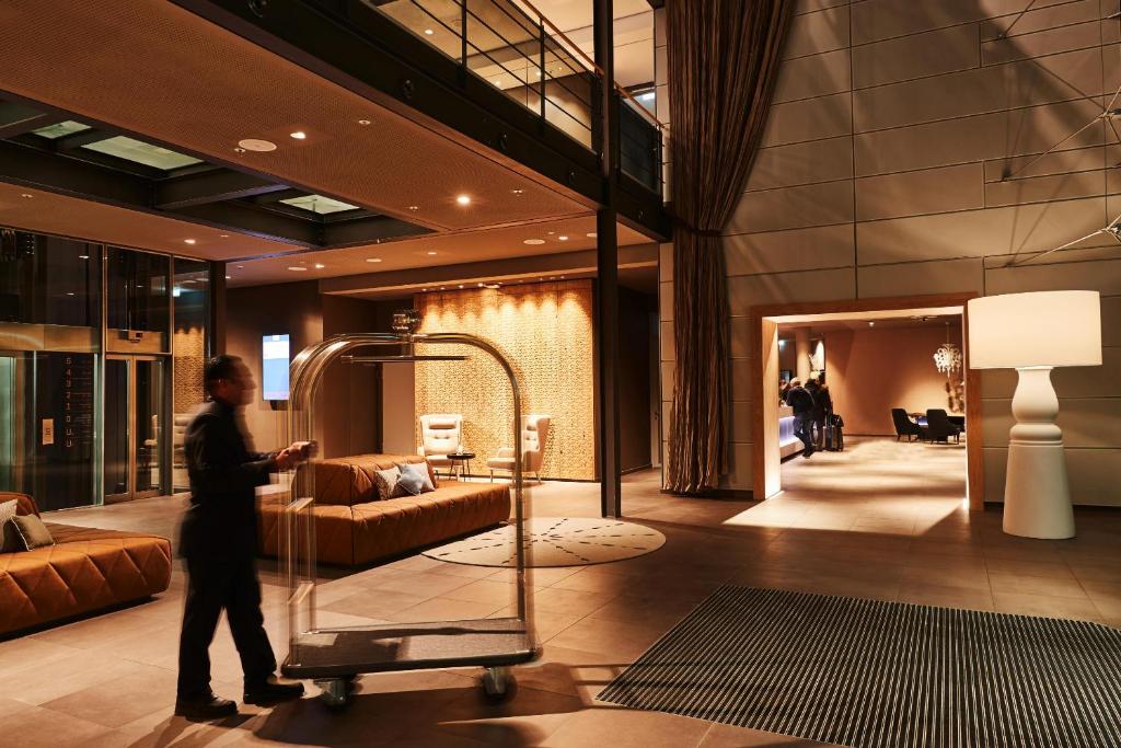 Postel nebo postele na pokoji v ubytování Steigenberger Hotel München