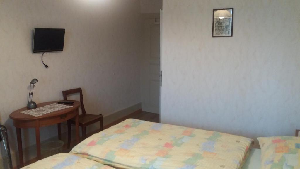 Postel nebo postele na pokoji v ubytování La Caquerelle