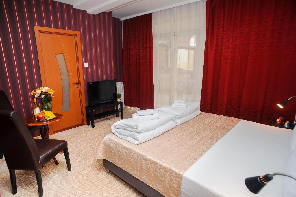 Postel nebo postele na pokoji v ubytování Villa Bulevar