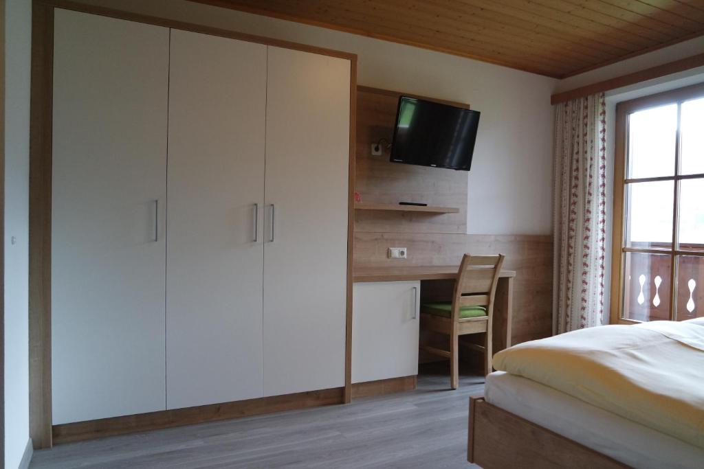 Postel nebo postele na pokoji v ubytování Gästehaus Davidbauer