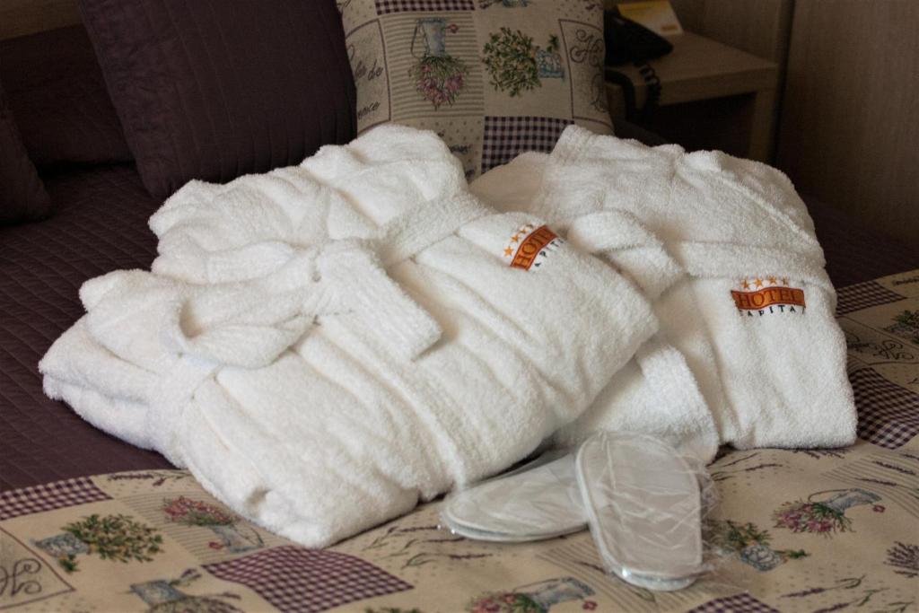 Postel nebo postele na pokoji v ubytování Hotel Capital