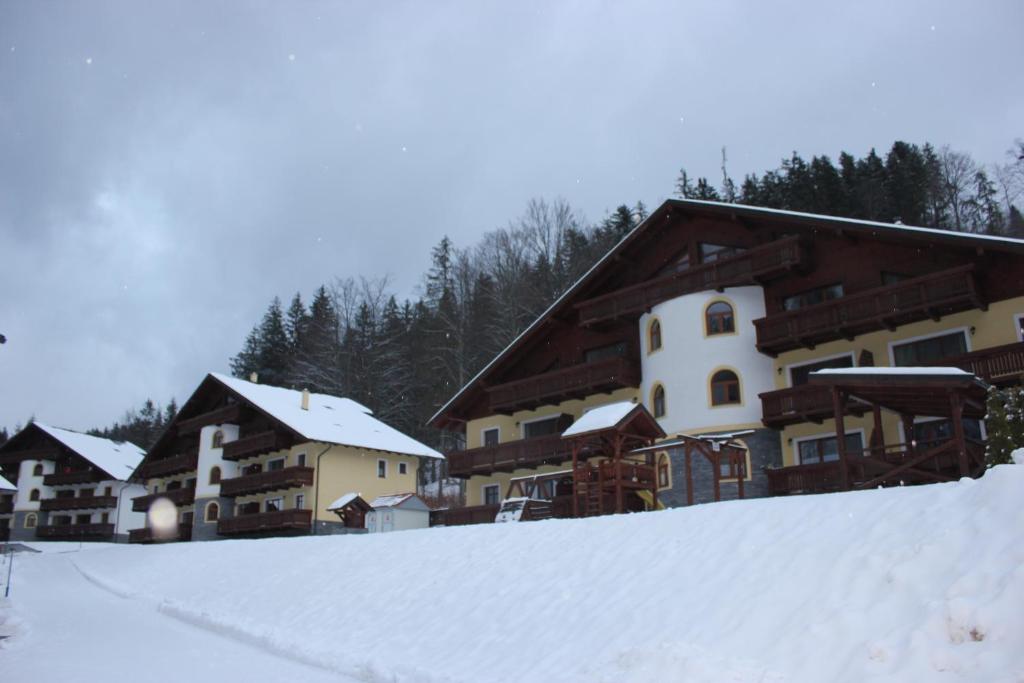 a group of buildings with snow on the ground at Apartmán Essi Tále- Chopok in Tale