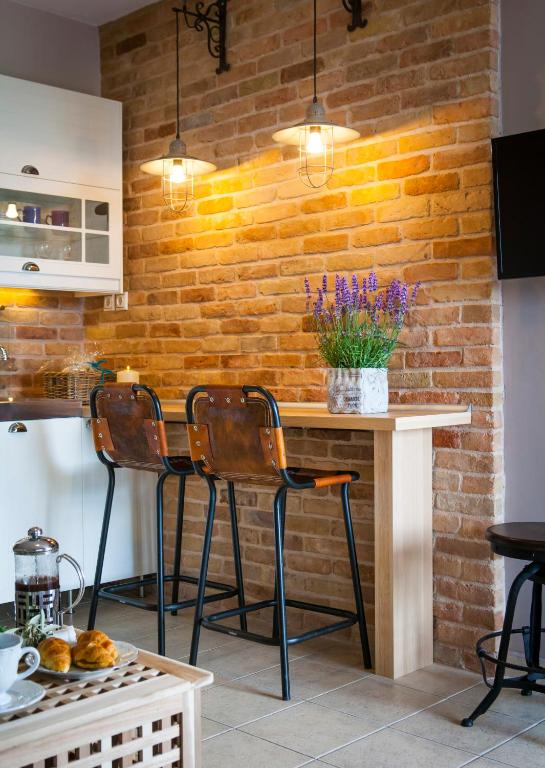 TV a/nebo společenská místnost v ubytování Villa Teresa Luxury Suites