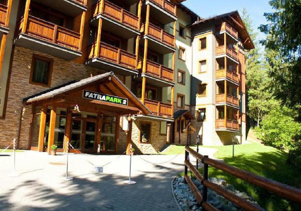 a building with a sign on the front of it at Fatrapark 2 in Ružomberok