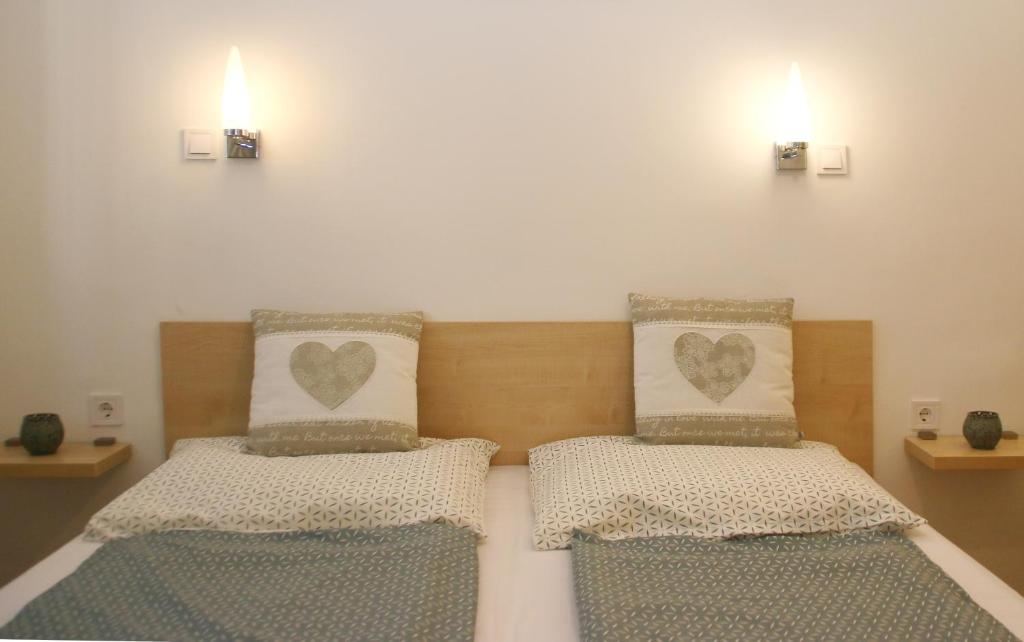 Postel nebo postele na pokoji v ubytování Avar Vendégház
