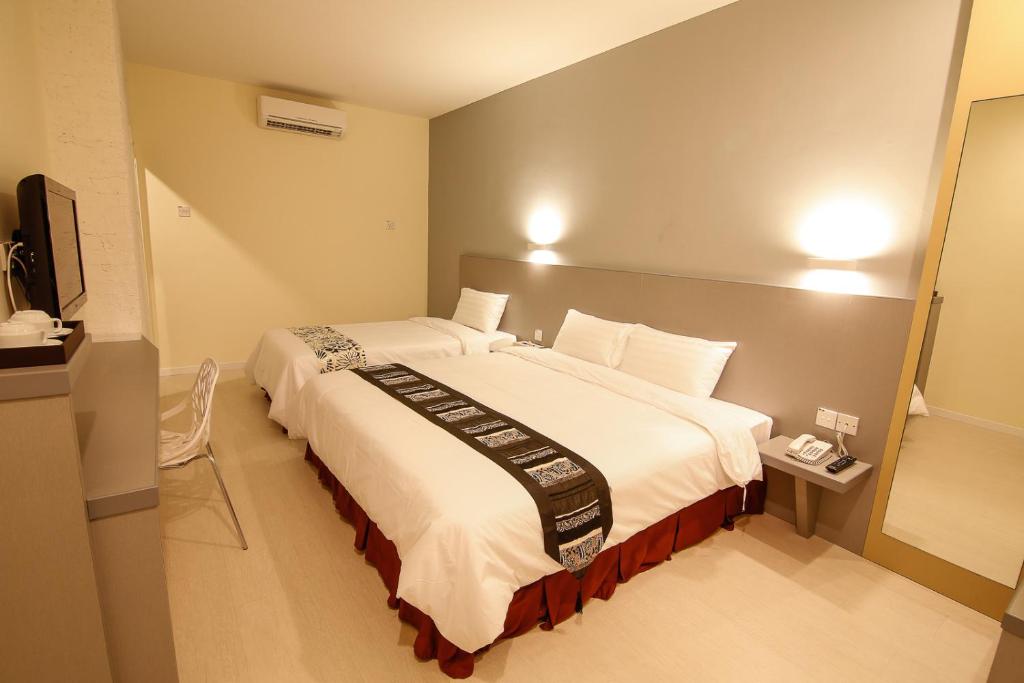 Postel nebo postele na pokoji v ubytování Art Cottage Hotel