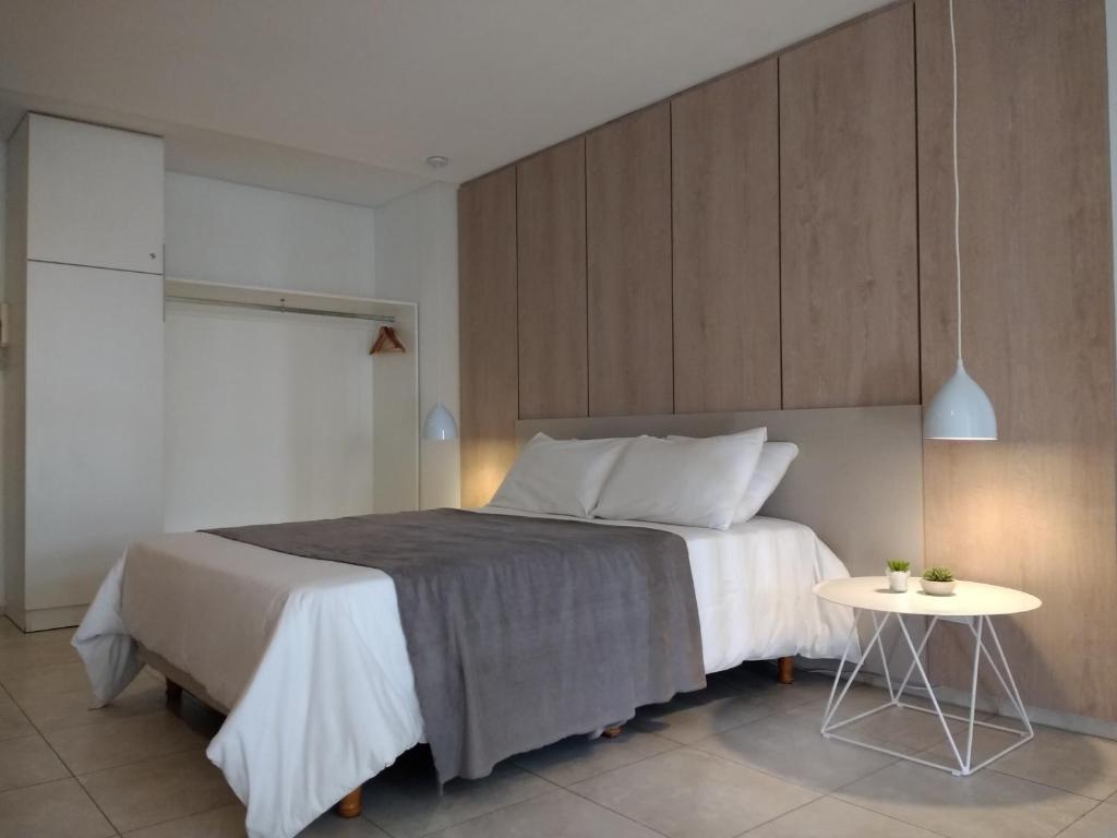 Postel nebo postele na pokoji v ubytování Departamentos Lugar