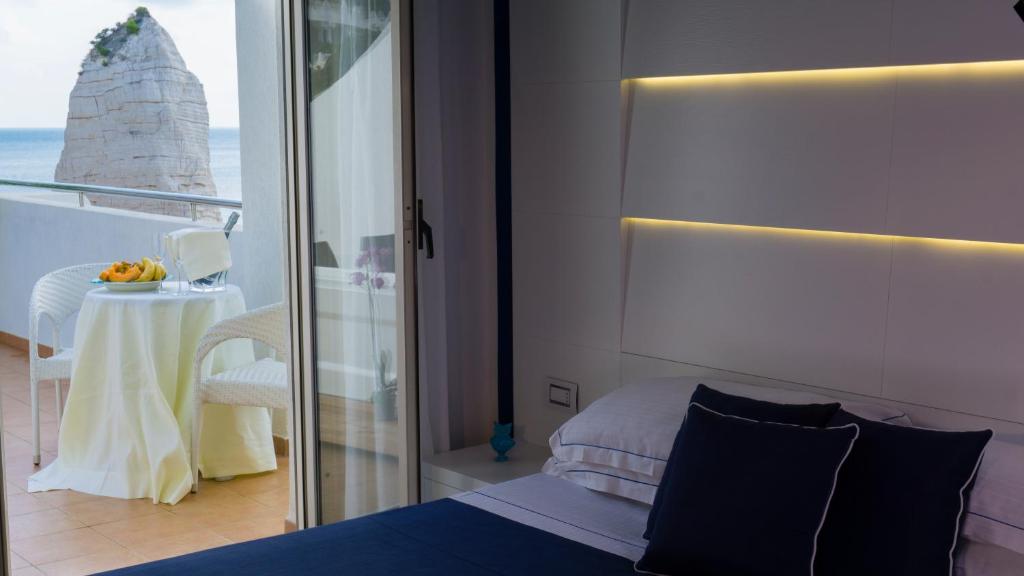 Postel nebo postele na pokoji v ubytování Hotel Scialara