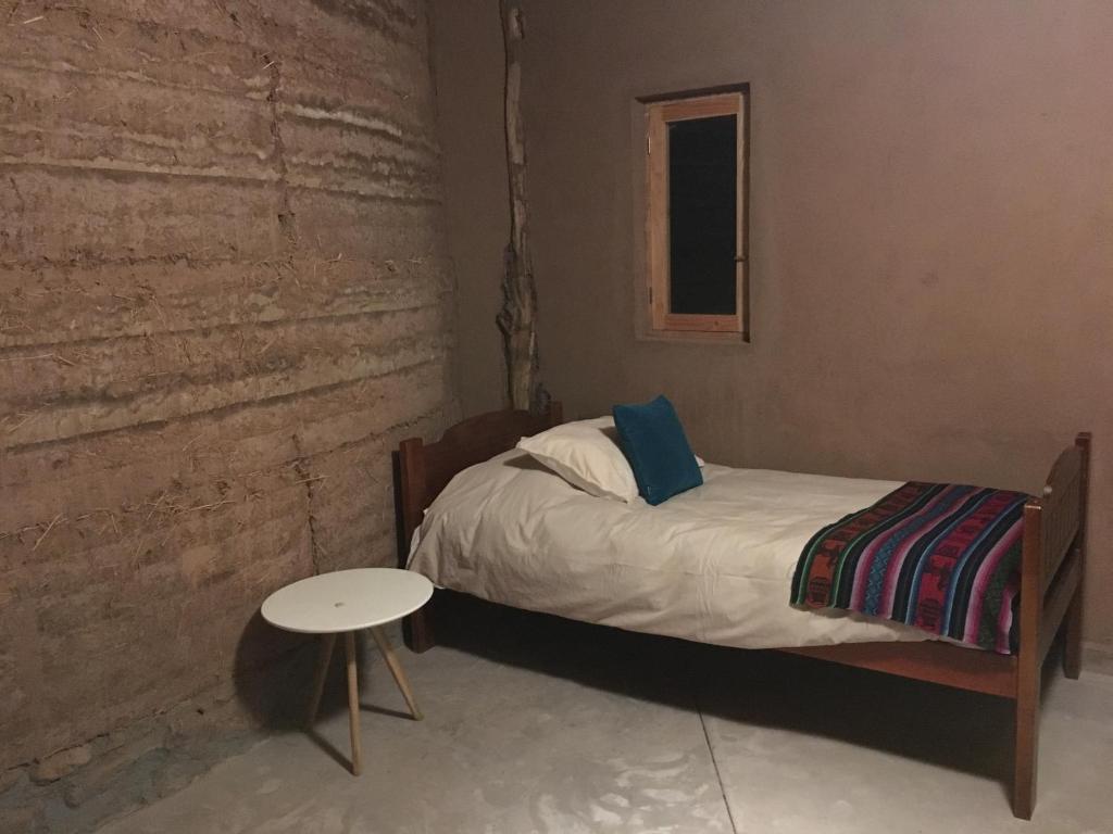 Postel nebo postele na pokoji v ubytování Vernacular Lodge