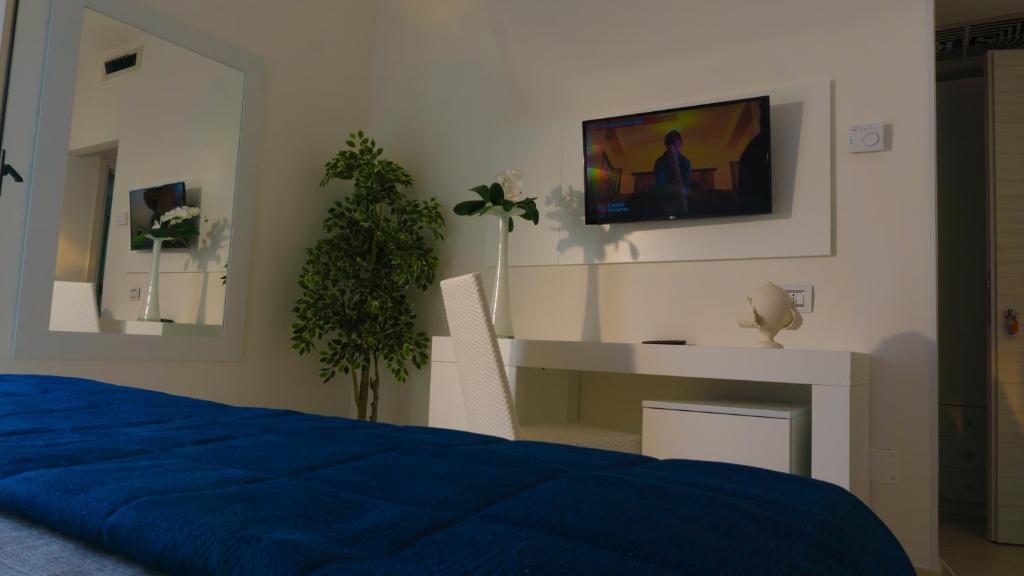 Postel nebo postele na pokoji v ubytování Hotel Scialara