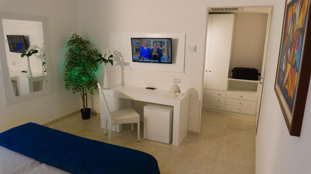 TV a/nebo společenská místnost v ubytování Hotel Scialara