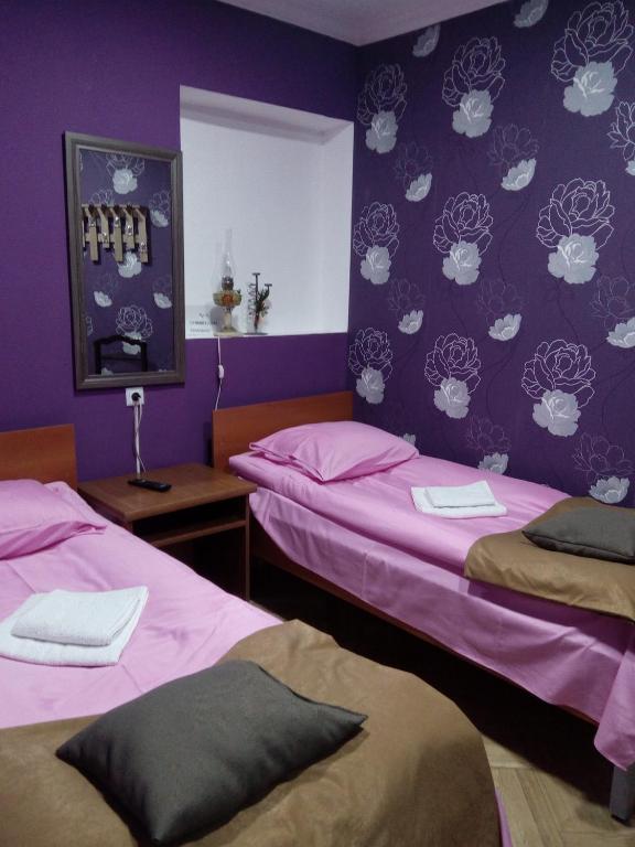 Postel nebo postele na pokoji v ubytování Tbilisi Downtown Guest House