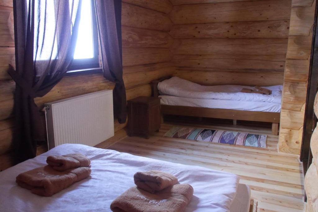 Postel nebo postele na pokoji v ubytování Berloga Pylypets