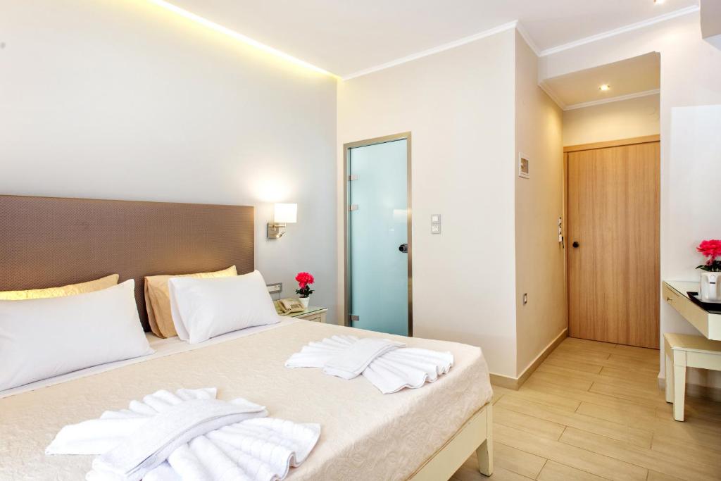 Postel nebo postele na pokoji v ubytování Hotel Ideon