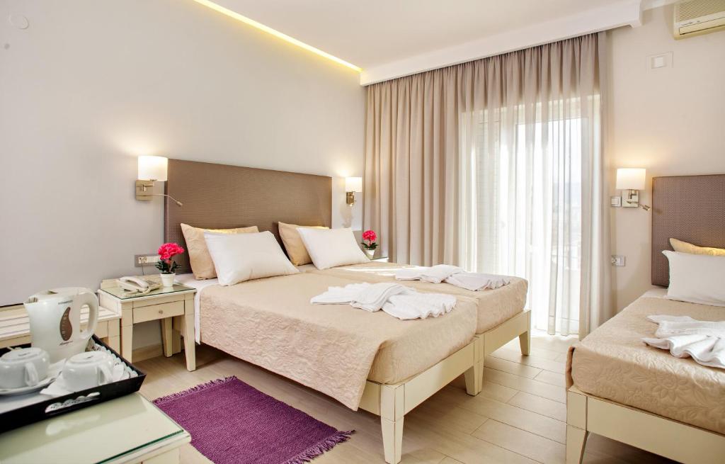 Postel nebo postele na pokoji v ubytování Hotel Ideon