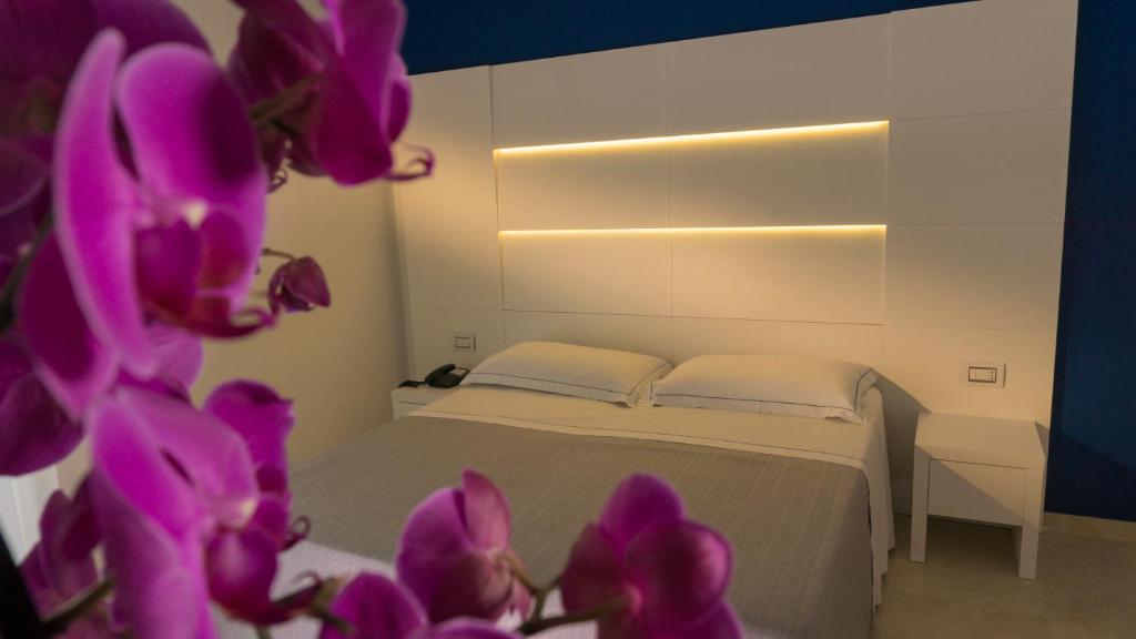 Postel nebo postele na pokoji v ubytování Hotel Scialara