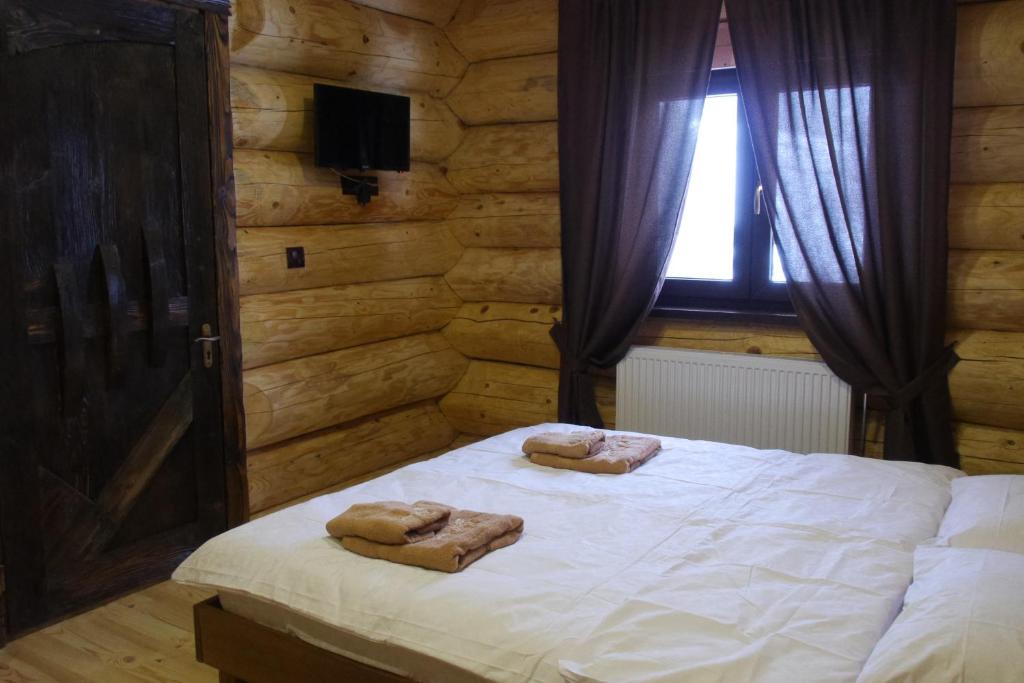 Postel nebo postele na pokoji v ubytování Berloga Pylypets