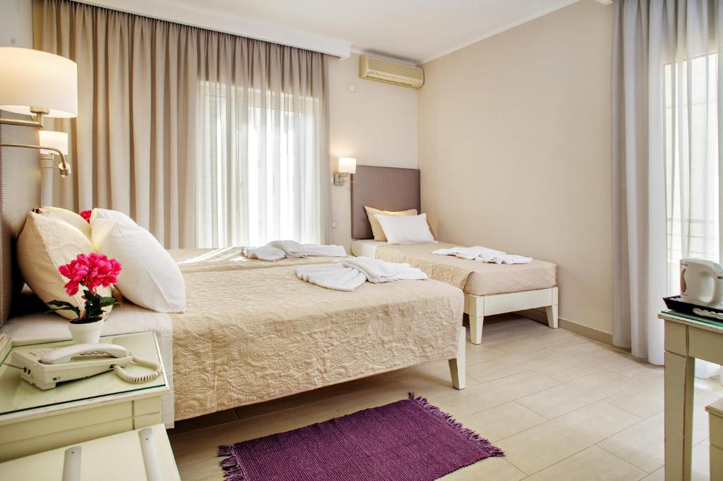 Postel nebo postele na pokoji v ubytování Hotel Ideon