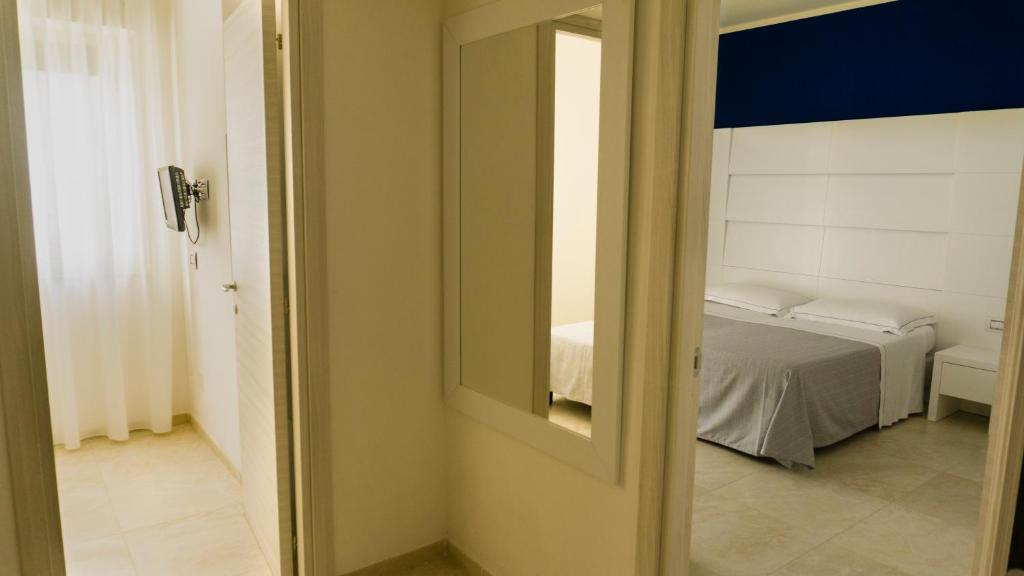 Postel nebo postele na pokoji v ubytování Hotel Scialara