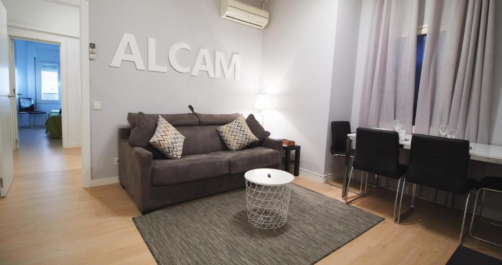 a living room with a couch and a table at Alcam Valencia II in Barcelona