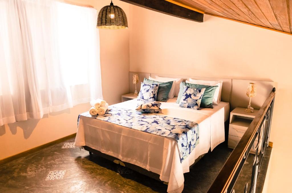 a bedroom with a bed with teddy bears on it at Residencial Brava Club Exclusive in Búzios
