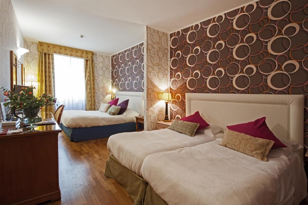 Postel nebo postele na pokoji v ubytování Hotel Palazzo Lovera