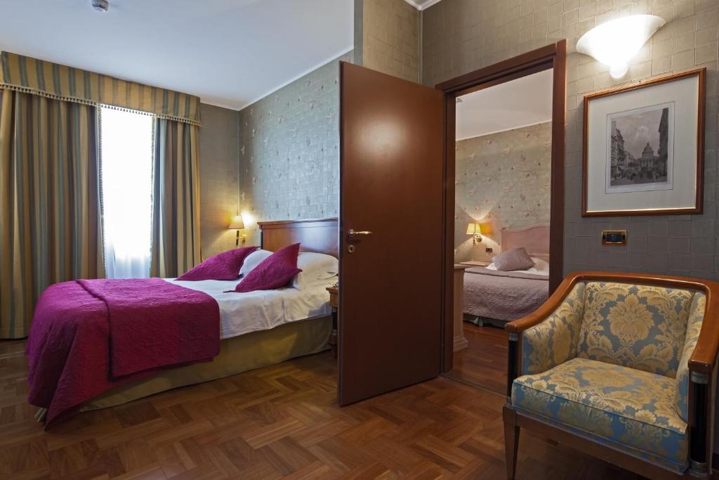Postel nebo postele na pokoji v ubytování Hotel Palazzo Lovera