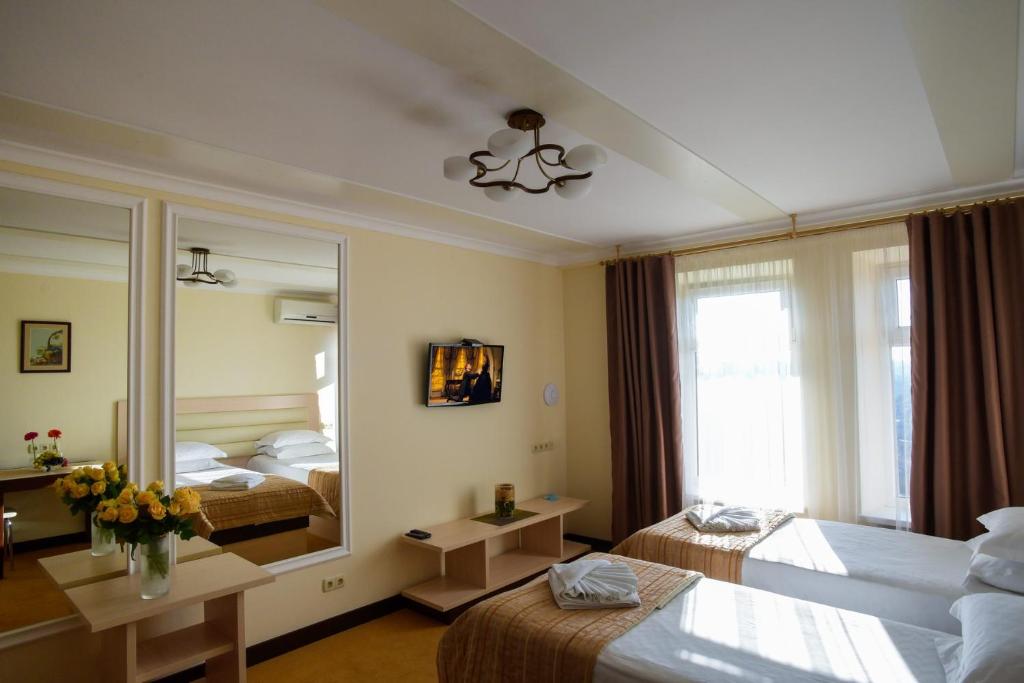 Postel nebo postele na pokoji v ubytování ApartHotel on Klinichna st. (1st entrance)