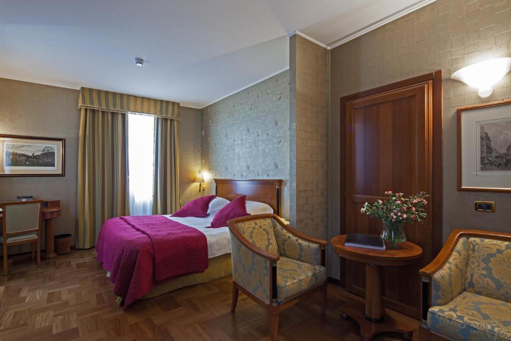 Postel nebo postele na pokoji v ubytování Hotel Palazzo Lovera