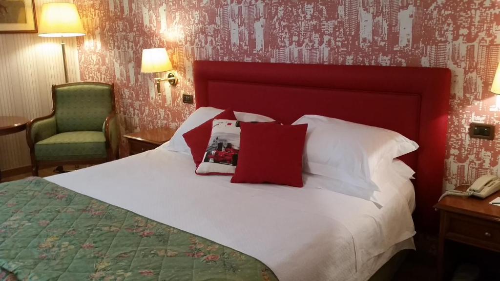Postel nebo postele na pokoji v ubytování Hotel Palazzo Lovera