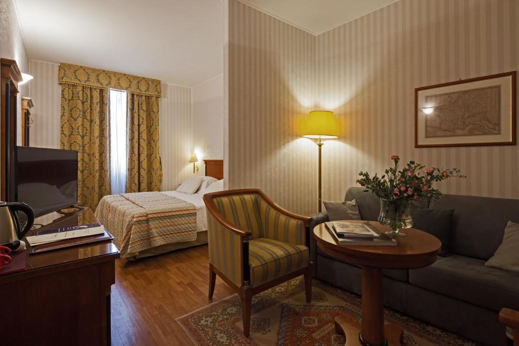 Postel nebo postele na pokoji v ubytování Hotel Palazzo Lovera
