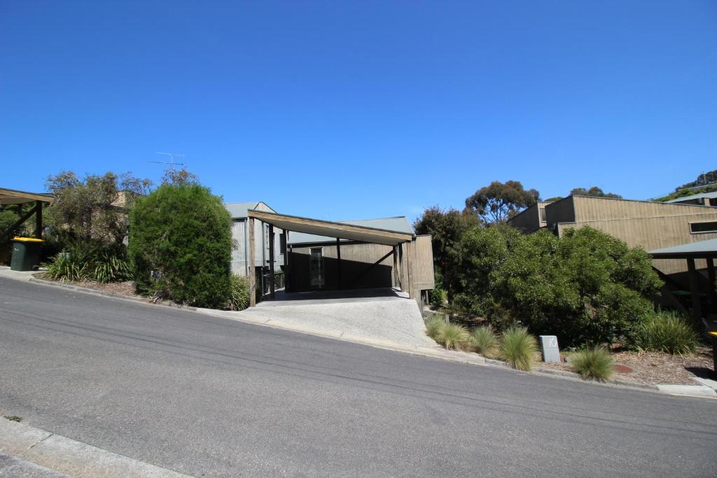 a building with a road in front of it at Lorne Holiday House in Lorne