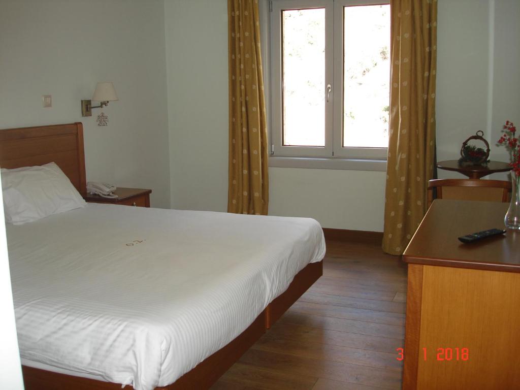 Posteľ alebo postele v izbe v ubytovaní Olympios Zeus Hotel