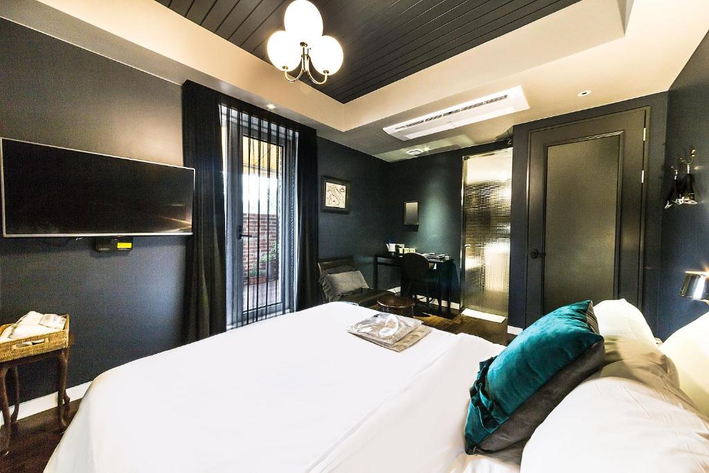 Postel nebo postele na pokoji v ubytování Roseto Hotel