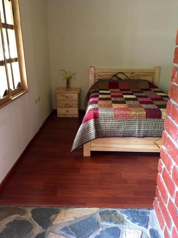 Postel nebo postele na pokoji v ubytování Cabañas Samay Mágico Ecolodge