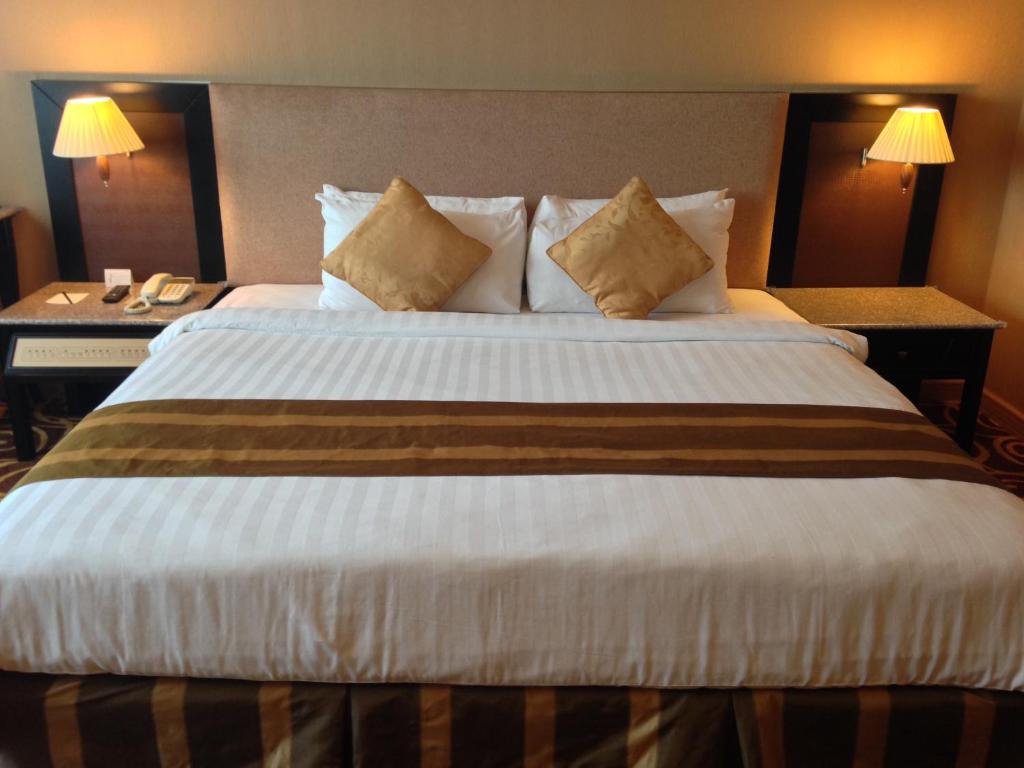 Mega Hotel Sdn Bhdにあるベッド