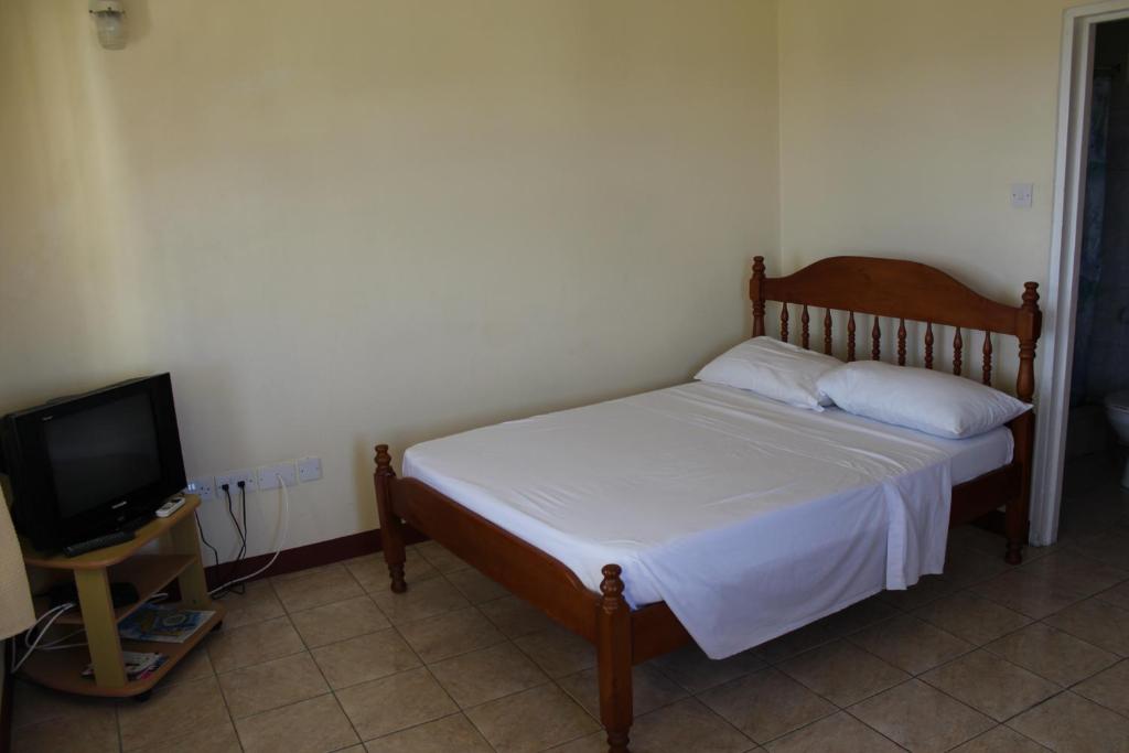 Postel nebo postele na pokoji v ubytování The Relax Inn