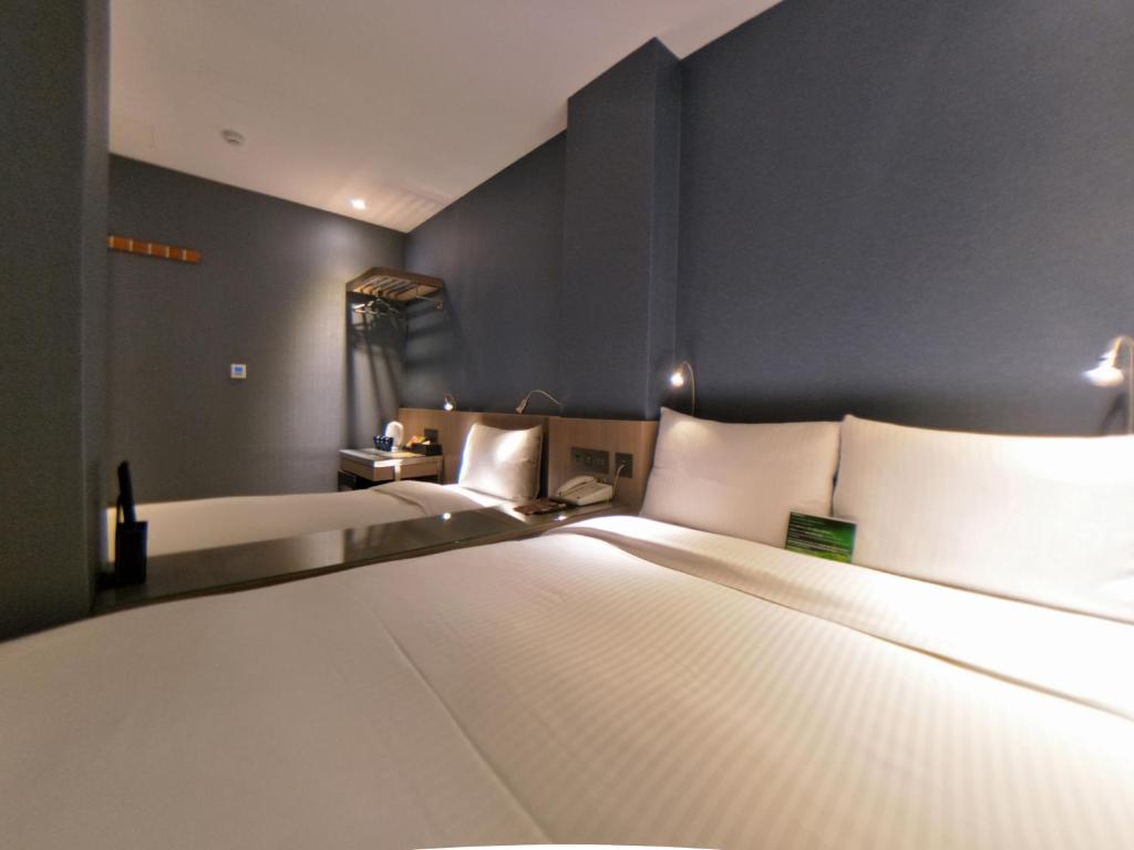Postel nebo postele na pokoji v ubytování Beauty Hotels Taipei - B7 Journey