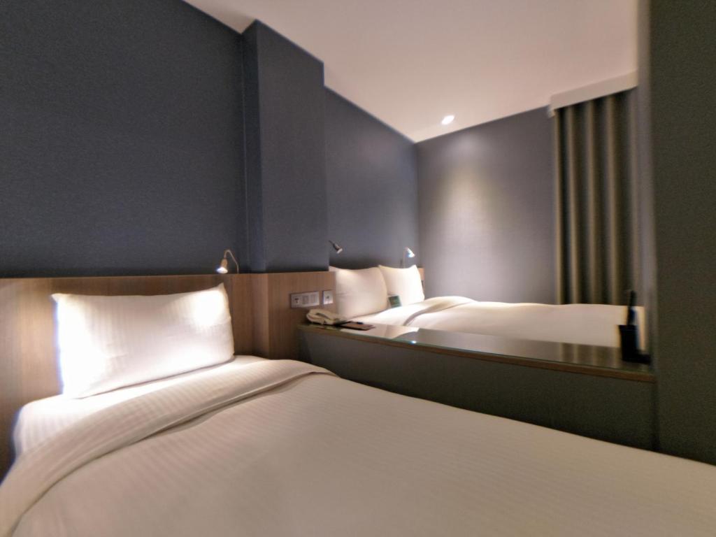 Postel nebo postele na pokoji v ubytování Beauty Hotels Taipei - B7 Journey
