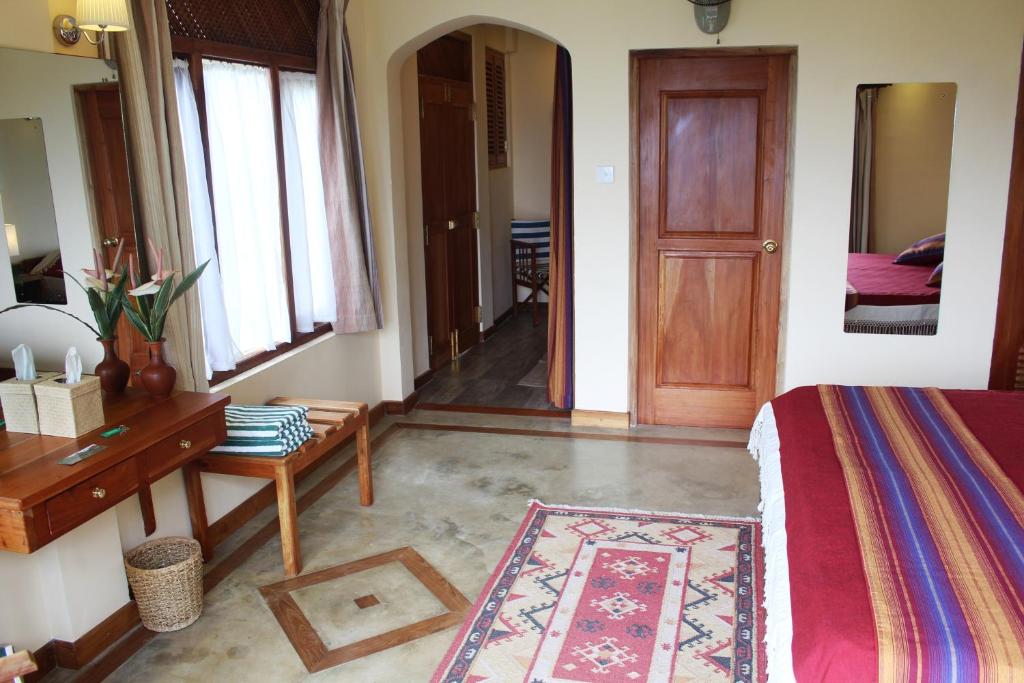 Postel nebo postele na pokoji v ubytování Rangala House